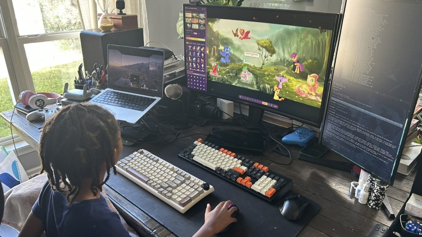 Josh's five-year-old building a colorful My Little Pony and Care Bears mashup sticker game in Codex
